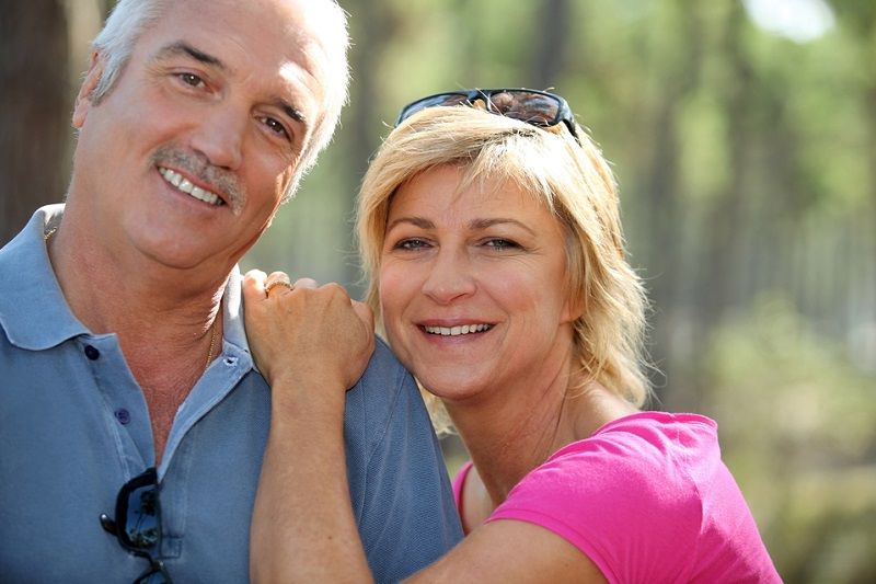 Senior Couple with Dental Implants Smiling